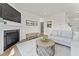 Open-concept living room featuring fireplace, comfortable seating and modern decor at 72 Cribbs Ln, Middlesex, NC 27557