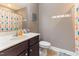 Well-lit bathroom with dark wood cabinets and neutral paint at 767 Omaha Dr, Broadway, NC 27505