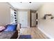 Bright bedroom features hardwood floors, closet, and built in shelves at 767 Omaha Dr, Broadway, NC 27505