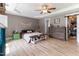 Spacious bedroom featuring a ceiling fan, tray ceiling, and a large closet at 767 Omaha Dr, Broadway, NC 27505