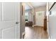 Inviting entryway with wood flooring, coat closet, and front door at 767 Omaha Dr, Broadway, NC 27505