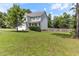 A well-manicured front lawn surrounds this two-story home, featuring a two-car garage and ample space for outdoor activities at 767 Omaha Dr, Broadway, NC 27505