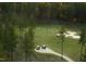 Stunning aerial view of the golf course, highlighting the beautiful layout, with lush trees and sand traps at 8 Pin Tail Ct, Pittsboro, NC 27312