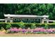 Chapel Ridge community sign surrounded by colorful flowers and greenery at 8 Pin Tail Ct, Pittsboro, NC 27312