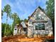 Exterior view of a two-story home under construction showing framing and window placement at 8 Pin Tail Ct, Pittsboro, NC 27312