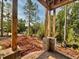 Covered front porch under construction, highlighting exposed framing and a view of the yard at 8 Pin Tail Ct, Pittsboro, NC 27312
