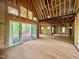 Spacious, framed living area with large sliding glass doors leading to the back yard at 8 Pin Tail Ct, Pittsboro, NC 27312