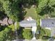 An aerial view of a house with a large backyard featuring a playset, shed, and well-manicured lawn at 821 Van Thomas Dr, Raleigh, NC 27615