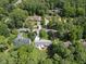 Aerial view of neighborhood with tree lined streets, mature landscaping, and well maintained homes at 821 Van Thomas Dr, Raleigh, NC 27615