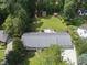 Aerial view showcasing the home's well-maintained lawn, mature trees, and desirable neighborhood at 821 Van Thomas Dr, Raleigh, NC 27615