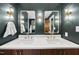 Modern bathroom with double vanity sinks, designer lighting, and stylish fixtures at 821 Van Thomas Dr, Raleigh, NC 27615
