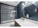 Modern bathroom with sleek vanity, a shower over the tub, and stylish fixtures at 821 Van Thomas Dr, Raleigh, NC 27615
