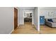 Inviting foyer featuring light-gray walls, wood flooring, and a glimpse into the living room at 821 Van Thomas Dr, Raleigh, NC 27615
