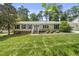 Charming single-story home with manicured lawn and neatly landscaped front yard, exuding classic curb appeal at 821 Van Thomas Dr, Raleigh, NC 27615