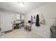 Bright laundry area featuring a functional desk, ample storage, and stylish tile flooring at 821 Van Thomas Dr, Raleigh, NC 27615