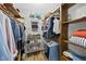 Large walk-in closet with shelving, hanging rods, and ample room for storage at 821 Van Thomas Dr, Raleigh, NC 27615