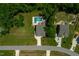 Aerial view of two-story home featuring an in-ground pool and beautiful backyard at 8341 Running Fern Way, Willow Springs, NC 27592