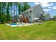 A lovely backyard pool with lounge chairs and a well-kept lawn in this beautiful home at 8341 Running Fern Way, Willow Springs, NC 27592