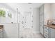 Bathroom featuring a glass shower, a bench, and bright white backsplash at 8341 Running Fern Way, Willow Springs, NC 27592