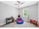 A whimsical bedroom with playful decor, a toy car bed, and a bright window at 8341 Running Fern Way, Willow Springs, NC 27592