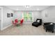 Comfortable bonus room with a small table and seating, perfect for relaxation or game nights at 8341 Running Fern Way, Willow Springs, NC 27592