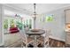 Bright dining area with natural light and a round table at 8341 Running Fern Way, Willow Springs, NC 27592