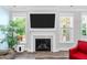 Fireplace with a TV at 8341 Running Fern Way, Willow Springs, NC 27592
