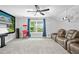 Home theater with comfortable seating, large screen, and popcorn machine for an immersive viewing experience at 8341 Running Fern Way, Willow Springs, NC 27592