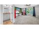 Spacious home theater area features a large screen, red vintage refrigerator and popcorn machine for ultimate movie nights at 8341 Running Fern Way, Willow Springs, NC 27592