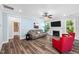 Cozy living room with a fireplace, TV, and comfortable seating at 8341 Running Fern Way, Willow Springs, NC 27592
