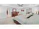 Bright main bedroom featuring a large bed and a view into an additional space at 8341 Running Fern Way, Willow Springs, NC 27592