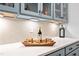Close-up of pantry showcasing the beverage storage, white countertop, and stylish cabinets at 8341 Running Fern Way, Willow Springs, NC 27592