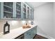 Walk-in pantry with stylish blue cabinetry, ample storage, and countertop space at 8341 Running Fern Way, Willow Springs, NC 27592