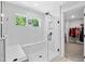 Bright shower with herringbone tile, glass enclosure, and a bench, leading to the walk-in closet at 8341 Running Fern Way, Willow Springs, NC 27592