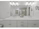 Bathroom with a dual vanity and large mirror at 8412 Old Deer Trl, Raleigh, NC 27615