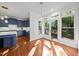 Inviting dining area with a view of the outdoor deck and seamlessly connected to the modern kitchen at 8412 Old Deer Trl, Raleigh, NC 27615