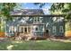 Rear exterior view of home with back deck at 8412 Old Deer Trl, Raleigh, NC 27615