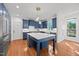 Spacious kitchen with island, stainless steel appliances, and stylish cabinetry at 8412 Old Deer Trl, Raleigh, NC 27615