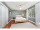 Bedroom with green walls, hardwood floors, and natural light at 9021 Winged Thistle Ct, Raleigh, NC 27617