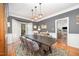 Stylish dining room featuring a dark wood table with seating for six and unique lighting at 9021 Winged Thistle Ct, Raleigh, NC 27617
