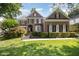 Charming brick home with manicured landscaping, black shutters, and a welcoming front entrance at 9021 Winged Thistle Ct, Raleigh, NC 27617