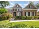 Charming brick home with manicured landscaping, black shutters, and a welcoming front entrance at 9021 Winged Thistle Ct, Raleigh, NC 27617