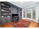 Features built-in shelving, a bay window for natural light, and hardwood flooring at 9021 Winged Thistle Ct, Raleigh, NC 27617