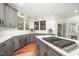 Modern kitchen with stainless steel appliances, gray cabinets, a gas stove and ample counter space at 9021 Winged Thistle Ct, Raleigh, NC 27617