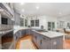 Modern kitchen with stainless steel appliances, gray cabinets, a gas stove and ample counter space at 9021 Winged Thistle Ct, Raleigh, NC 27617
