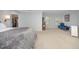 Spacious main bedroom with a large bed, walk-in closet, and additional seating area at 9021 Winged Thistle Ct, Raleigh, NC 27617