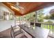 Relaxing screened patio with wood ceiling and ceiling fan at 9021 Winged Thistle Ct, Raleigh, NC 27617