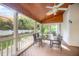 Relaxing screened patio with wood ceiling and ceiling fan at 9021 Winged Thistle Ct, Raleigh, NC 27617