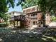 Multi-level wooden deck and stairs in the backyard of a brick home, providing outdoor access at 907 W Johnson St, Raleigh, NC 27605