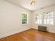 Bright bedroom with hardwood flooring and windows offering natural light at 907 W Johnson St, Raleigh, NC 27605